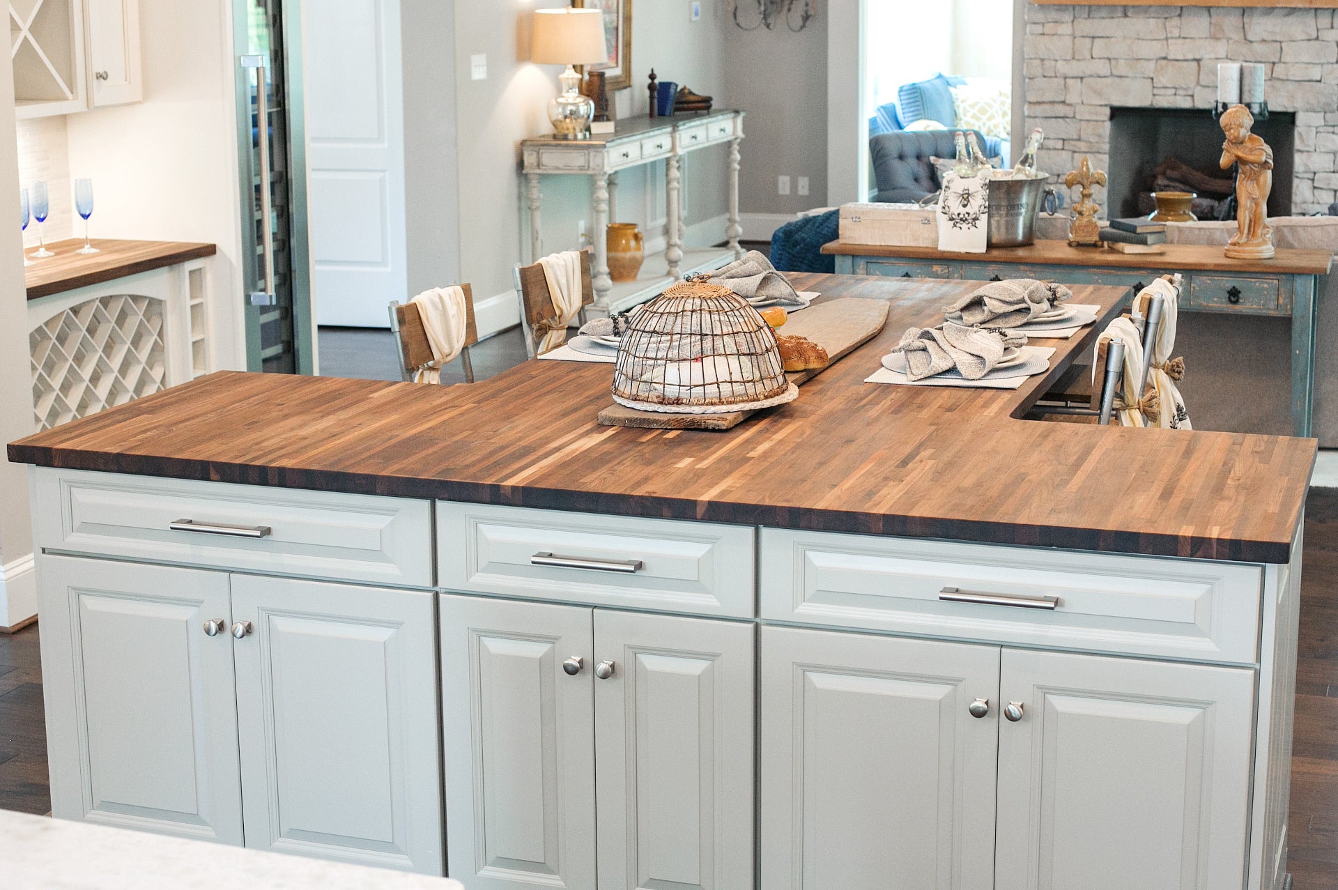 Modern kitchen with wooden countertop and light gray cabinets